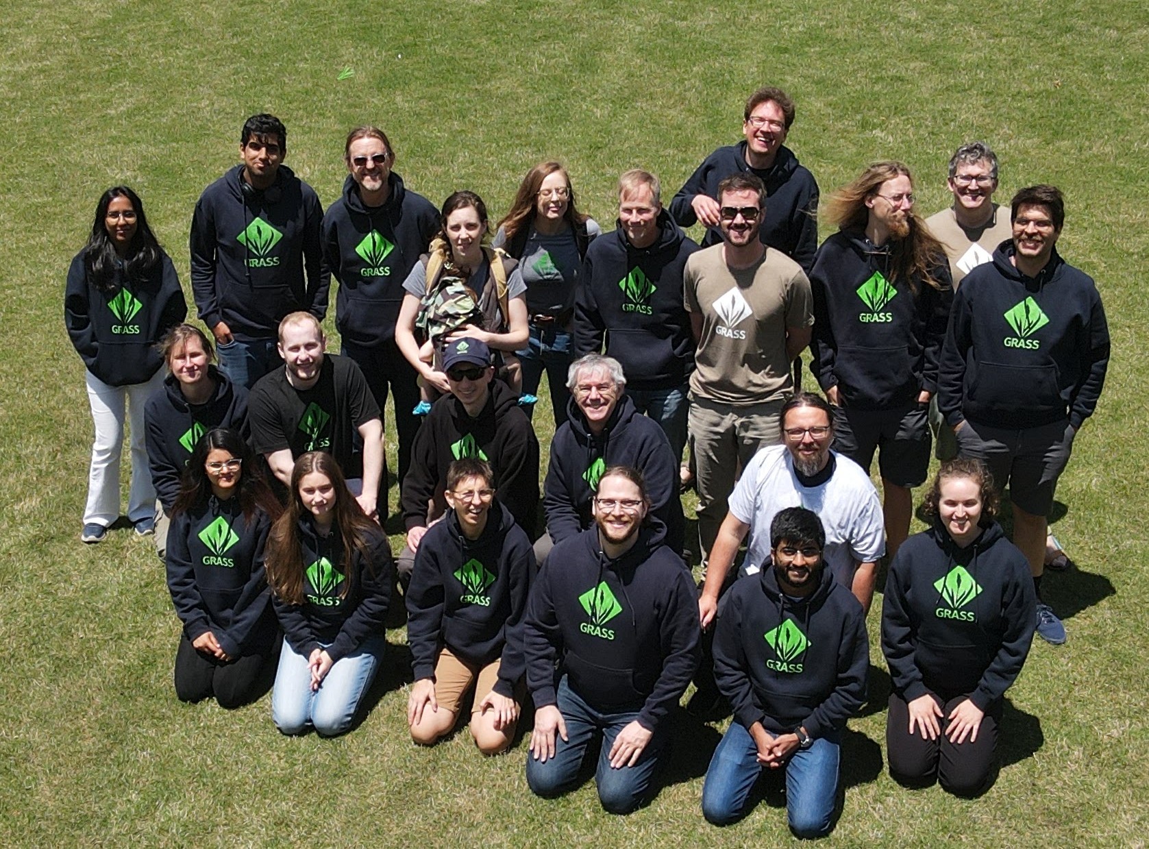 GRASS devs group picture next to Hunt Library, NC State